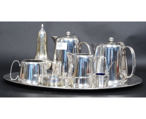 A good heavy silver plated tea service to consist of tea pot, coffee pot, creamer, sugar bowl, tea strainer and serving tray