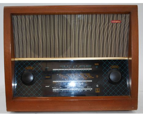 A vintage wooden case Murphy valve radio, in working order being recently serviced and PAT tested, with original retailers la