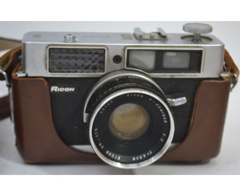 A leather cased vintage 35mm camera by Ricoh with original carry straps

UK, European & Worldwide packaging available on all 