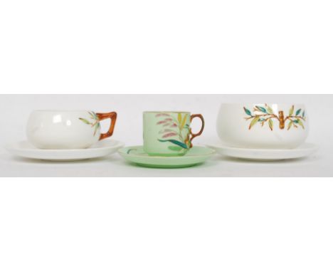 A 19th century George Jones green glaze teacup and saucer having diamond lozenge mark to base. Together with 2 believed Georg