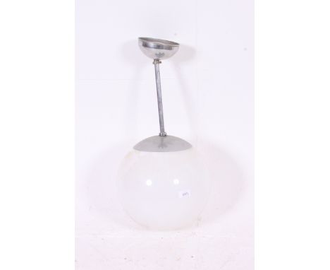 A retro 1970's large milk glass globe shade ceiling light complete with chrome arm bracket