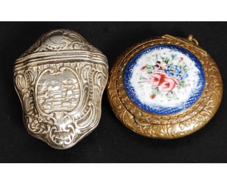 A Victorian enamel hanging compact with embossed brass body and blue flower enamel lid. Together with an unmarked silver cont