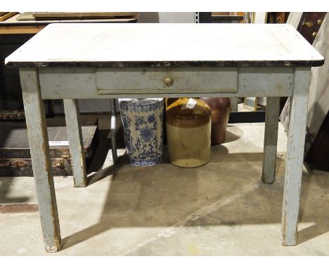 Vintage kitchen table with a white enamel top, on wooden supports&nbsp;
