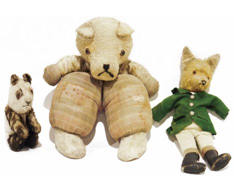 Edith Moody fox teddy bear with green jacket, trousers and boots, labelled to under tail, 36cm long, a&nbsp;1930's mohair pan