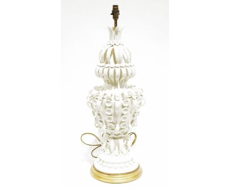 Ornate white ceramic table lamp&nbsp;with applied decoration of leaves and roses, on a circular stepped base, with a painted 