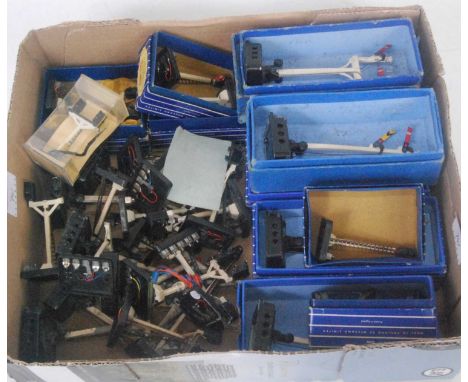 An assortment of mainly Hornby Dublo electric semaphore and colour light signals of all types some boxed, some broken, some w