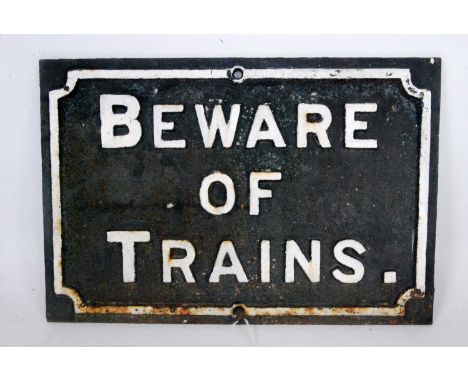 A original cast iron 'Beware of Trains' sign, dimensions 56cm x 38cm, original white on black example, white lettering may ha