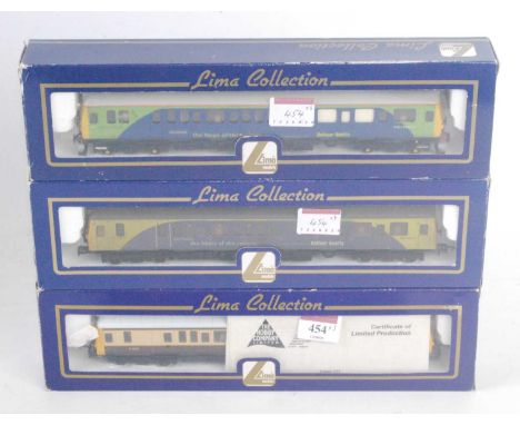 Three Lima Class 121 railcars: brown &amp; cream; Balfour Beatty green &amp; blue, and Balfour Beatty blue &amp; green, last 