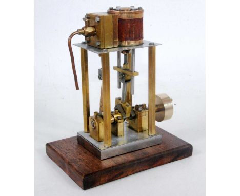 A stationary model of a live steam vertical single cylinder steam engine constructed from gunmetal and brass components, comp