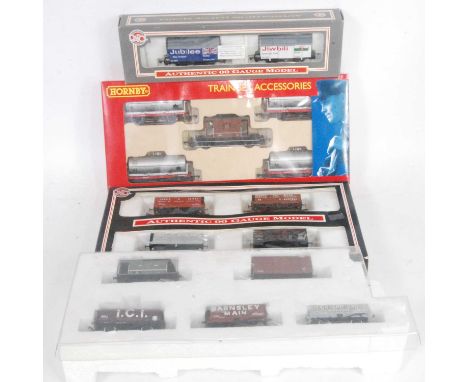 Large tray containing:- 16 mixed makes goods wagon, mainly Dapol and Hornby, mostly (M) in variety of original packaging 
