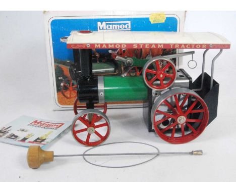 A Mamod TE1A traction engine of usual specification, comprising of green body with red spoked hubs and cream canopy, sold wit