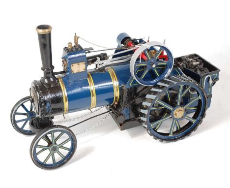 A static display model of an agricultural traction engine, approx 1" scale, finished in blue with yellow and brass boiler ban