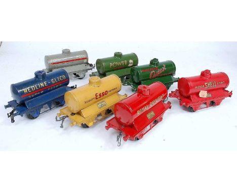 Seven assorted Hornby pre-war tank wagons:- Esso Buff, Redline Glico, Castrol, Power Ethyl, Pool, Royal Daylight and Shell Mo