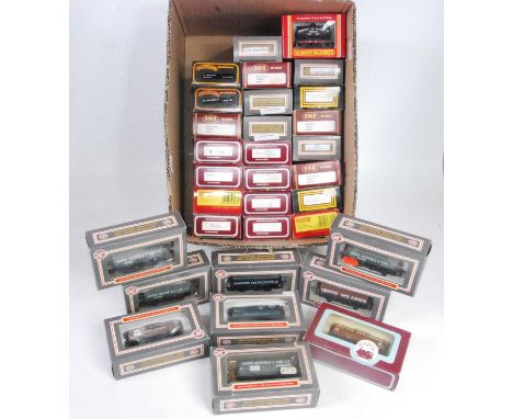 Large box containing 32 tank wagons, mixed makes, mixed liveries, some weathered:- Dapol/Hornby (VG-M) (BVG-NM)