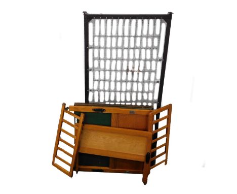 A pine framed child's bed, card table, and a wall mirror.