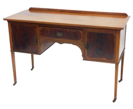 An early 20thC mahogany and chequer banded dressing table, with a raised back above an arrangement of two doors flanking a fr