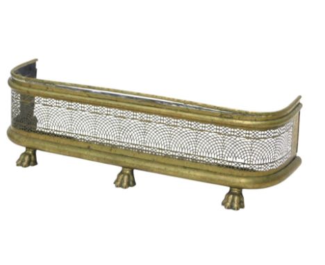 A 19thC brass fire curb or fender, with a pierced grill, on pad feet, 96cm wide.