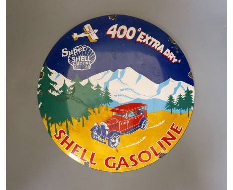 A circular shell gasoline enamel advertising sign - 29cm diameter