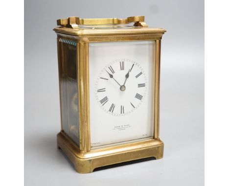 A French brass carriage clock, retailed by Drew and Sons, 166 Leadenhall Street London. 14.5cm (handle down)