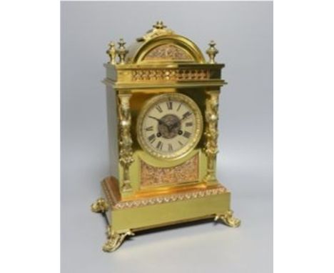 A late Victorian copper and brass mantel clock - 39cm tall