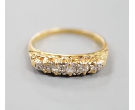 An 18ct and graduated five stone diamond set half hoop ring, size I, gross 2.8 grams.