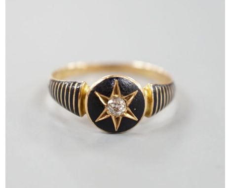 A late Victorian yellow metal, black enamel and diamond set mourning ring, the interior shank with engraved inscription, size
