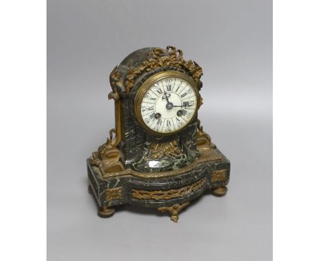 A 19th century French gilt metal mounted serpentine mantel clock,23cms high.