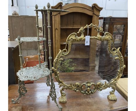 A brass mesh firescreen, width 60cm, height 63cm together with a three tier brass stand