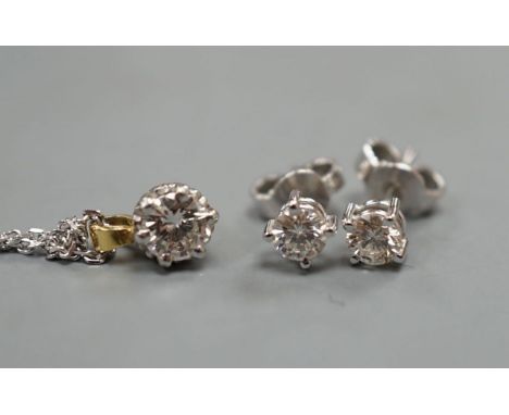 A pair of 18ct and solitaire diamond set ear stud, gross 1 grams and a solitaire diamond pendant on a 375 chain, gross 2.5 gr