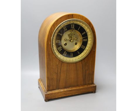 A late Victorian walnut mantel clock, French movement with pendulum, 35cm