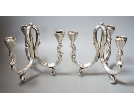 A pair of early 20th century German 835 white metal three light scroll arm candelabra, by Lutz &amp; Weiss, height 18cm,19oz.