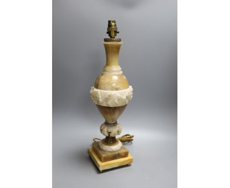 A carved alabaster table lamp
