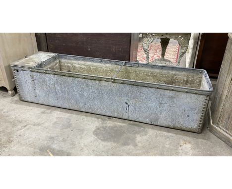 A large vintage galvanised water trough, length 187cm, depth 48cm, height 43cm