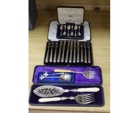 A cased pair of servers, and serving fork, cased silver coffee spoons, royal commemorative spoon, trefid coffee spoon, plated