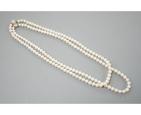 A Portuguese double strand cultured pearl necklace, with diamond set 800 finesse white metal clasp, 23.5cm.
