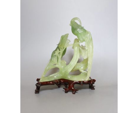 A bowenite jade bird group on wooden base - 23cm tall