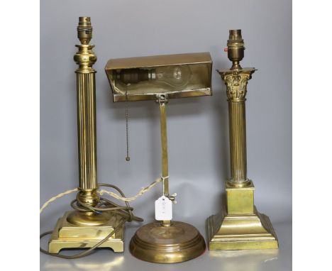 An Edwardian banker's lamp and two Corinthian column lamps - tallest 49cm