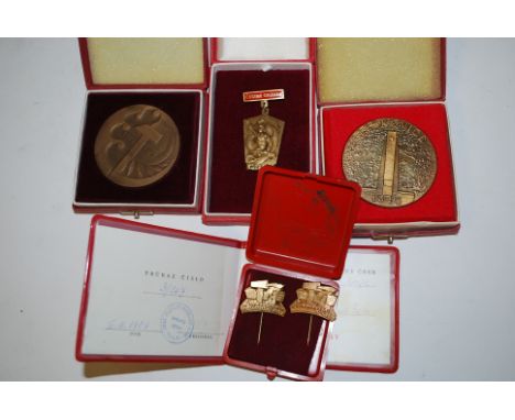 A collection of Russian enamel military badges / medals complete in presentation boxes to include