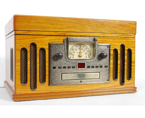 A 20th century contemporary record player having radio, all made in the vintage style