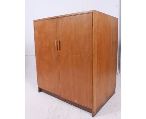 A large 1950's vintage architectural  / school plan chest of drawers cupboard having double doors with slatted interior linin