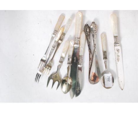 Victorian mother of pearl handled cake knives, two silver handled shoe horns, pickle fork and jam spoons.