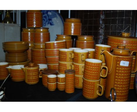 A near complete service of retro 1970's Hornsea Saffron pattern china to include tea set, plates jars etc