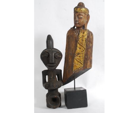 An African tribal statue pipe carving together with a tribal mask statue raised over wooden ebonised plinth base