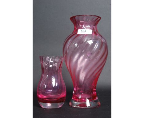 Two Caithness cranberry glass twist vases. 