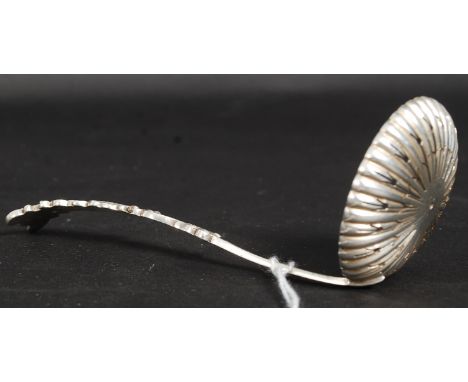 An Edwardian silver hallmarked caddy spoon  having circular pierced bowl with Sheffield Hallmarks 1901, makers James Dixon & 