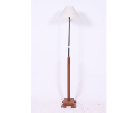 A 1930's Art Deco teak and chrome standard lamp. The teak base with part  chrome upright.  H155cm x W23cm x D23cm