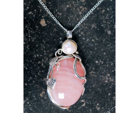 A large white metal 925 silver rose quartz and pearl set necklace on white metal chain.  Weight 33.1 grams