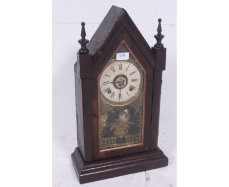 A 20th century Ansonia oak cased brass movement mantel clock. H52cm x W30cm