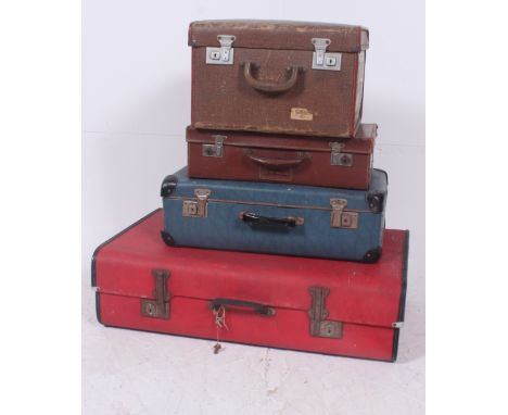 A good stack of vintage 20th century trunks / suitcases to include a good red and blue example, hat box with Anchor Line Bomb