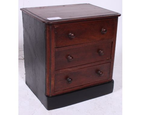 A Victorian mahogany apprentice piece chest of drawers. The chest with a bank of drawers having plinth base with caddy top 28